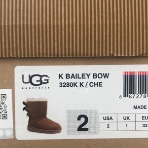 Brown Uggs (brown bow on the back )